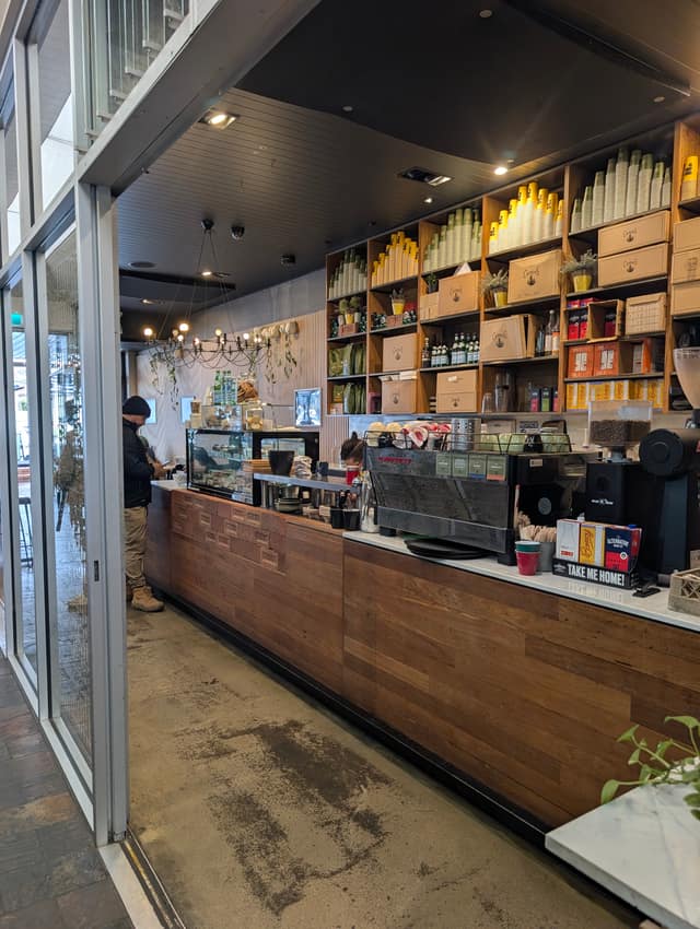 Espresso machine and Campos coffee at the counter