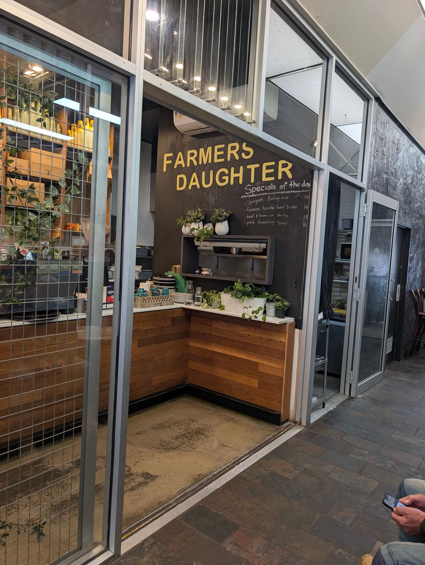 The kitchen pass at Farmers Daughter with the daily specials written on the blackboard